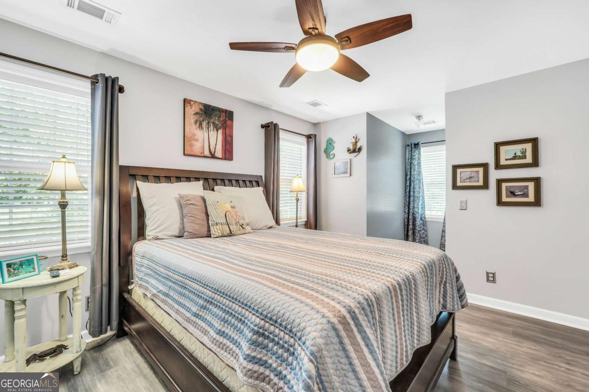 159 County Line Road Locust Grove, GA 30248 - Photo 52 of 100 a bedroom with a large bed and a chandelier