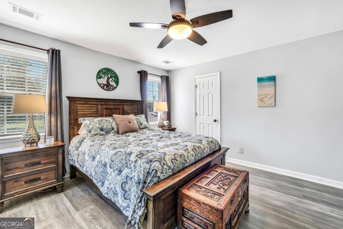 159 County Line Road Locust Grove, GA 30248 - Photo 53 of 100 a bedroom with a bed and a chandelier