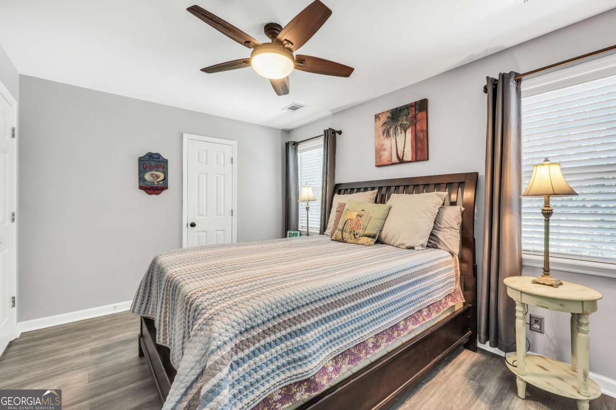 159 County Line Road Locust Grove, GA 30248 - Photo 54 of 100 a bedroom with a bed and a chandelier