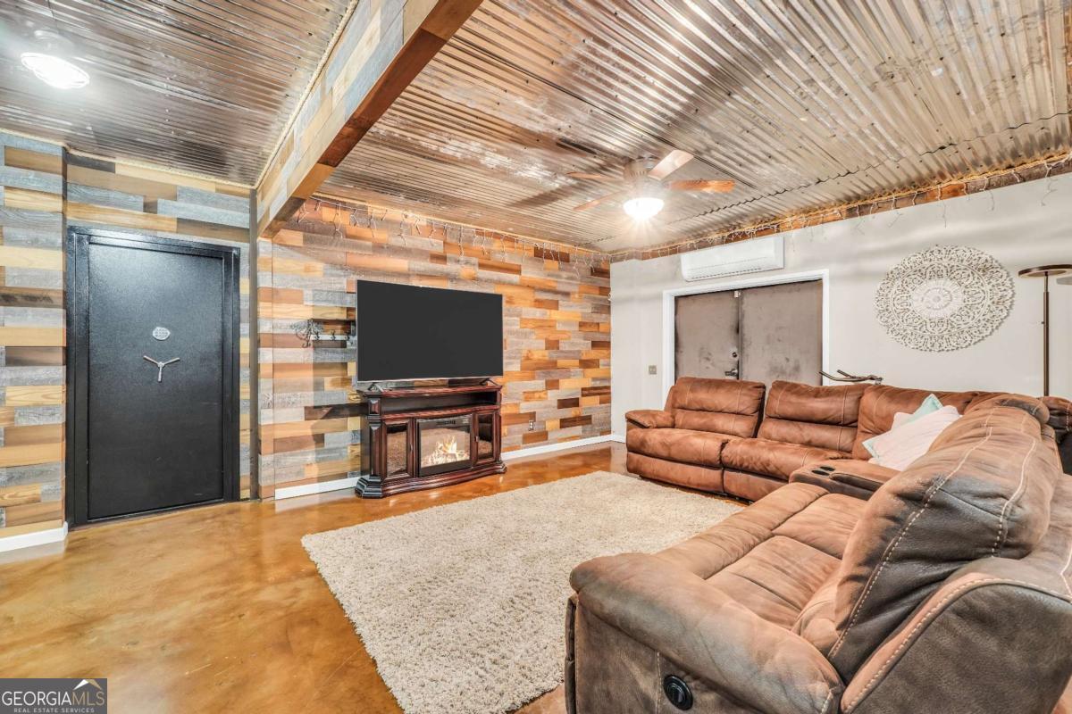 159 County Line Road Locust Grove, GA 30248 - Photo 66 of 100 a living room with furniture and a flat screen tv