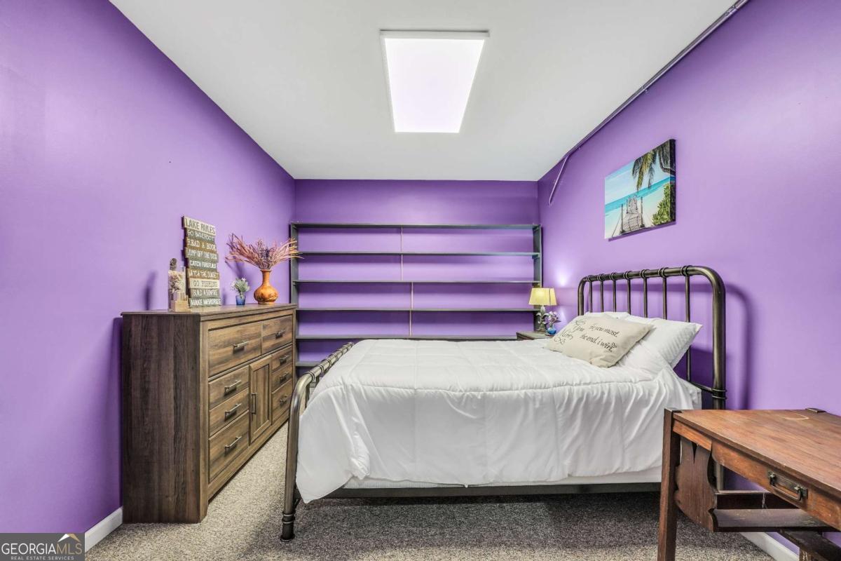 159 County Line Road Locust Grove, GA 30248 - Photo 77 of 100 a bedroom with a bed and wooden floor