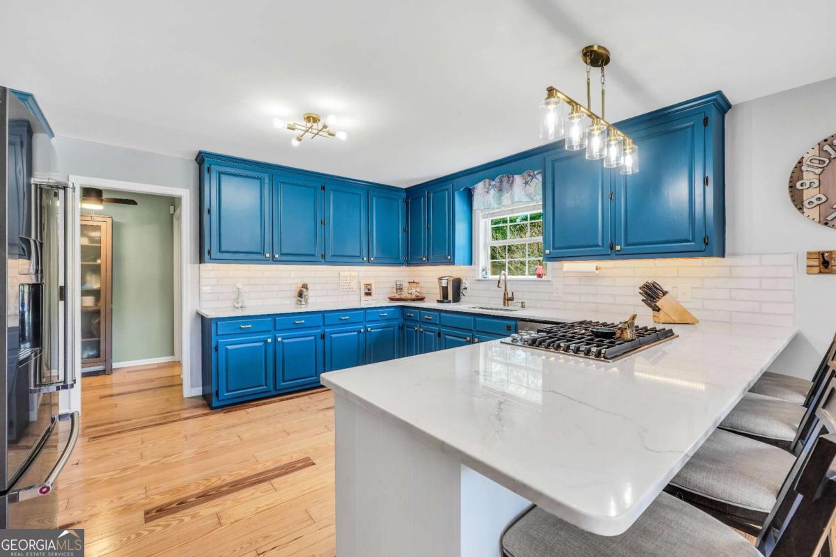 159 County Line Road Locust Grove, GA 30248 - Photo 8 of 100 a kitchen with a sink a stove and cabinets