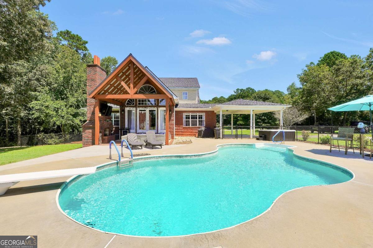159 County Line Road Locust Grove, GA 30248 - Photo 85 of 100 a view of a house with swimming pool and porch