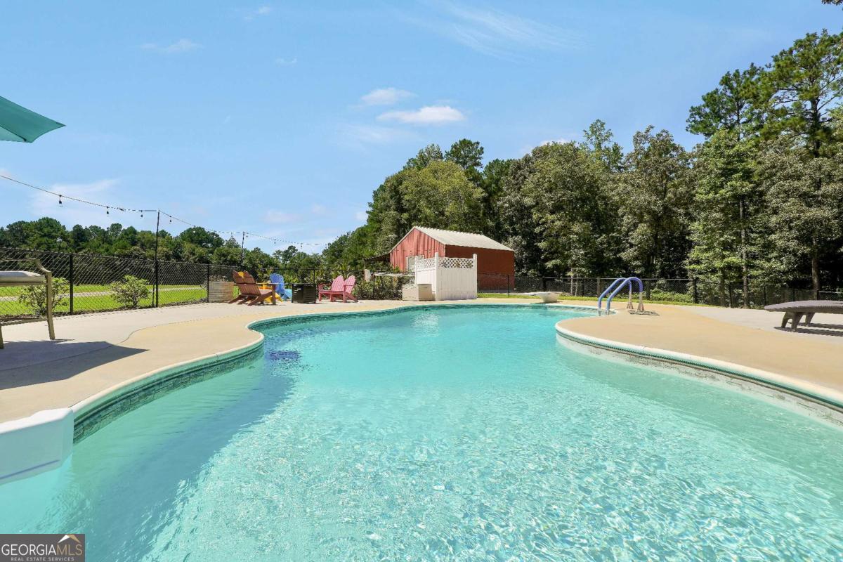 159 County Line Road Locust Grove, GA 30248 - Photo 87 of 100 a view of house with swimming pool and yard
