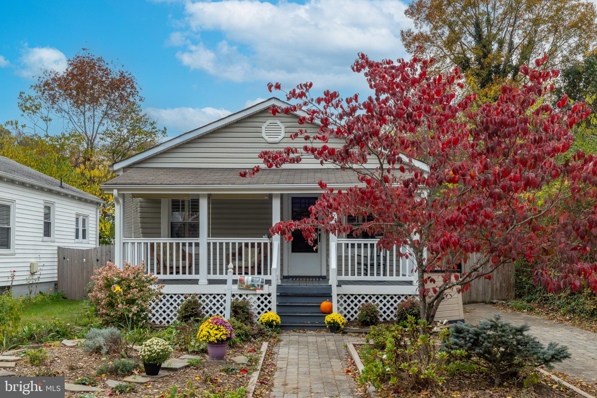 1424 Littlepage Street Fredericksburg, VA 22401 - Photo 1 of 34 a front view of a house with a garden