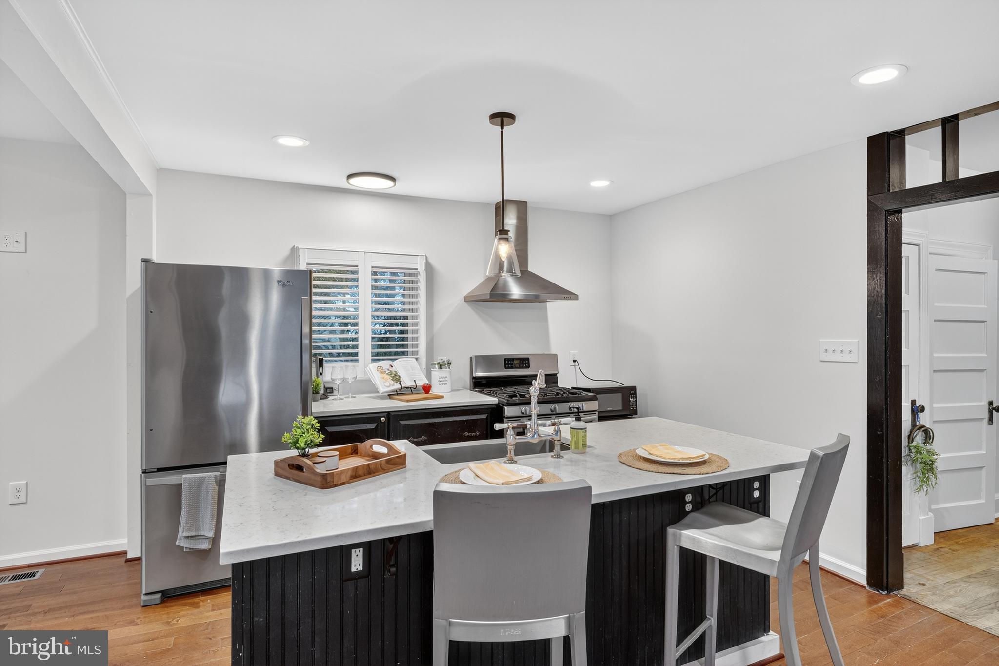 1424 Littlepage Street Fredericksburg, VA 22401 - Photo 13 of 34 a kitchen with stainless steel appliances a sink stove and refrigerator