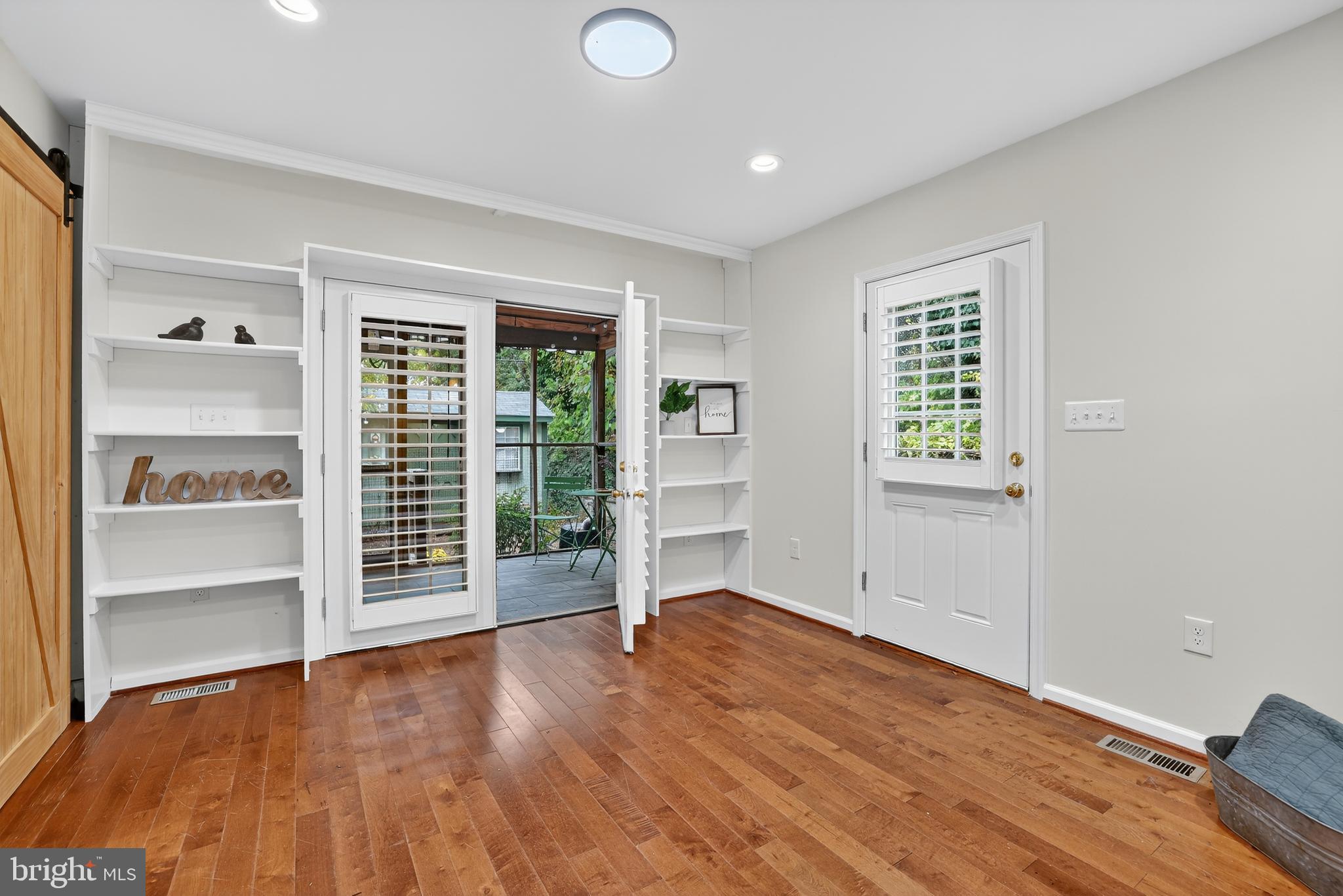 1424 Littlepage Street Fredericksburg, VA 22401 - Photo 17 of 34 an empty room with wooden floor and windows