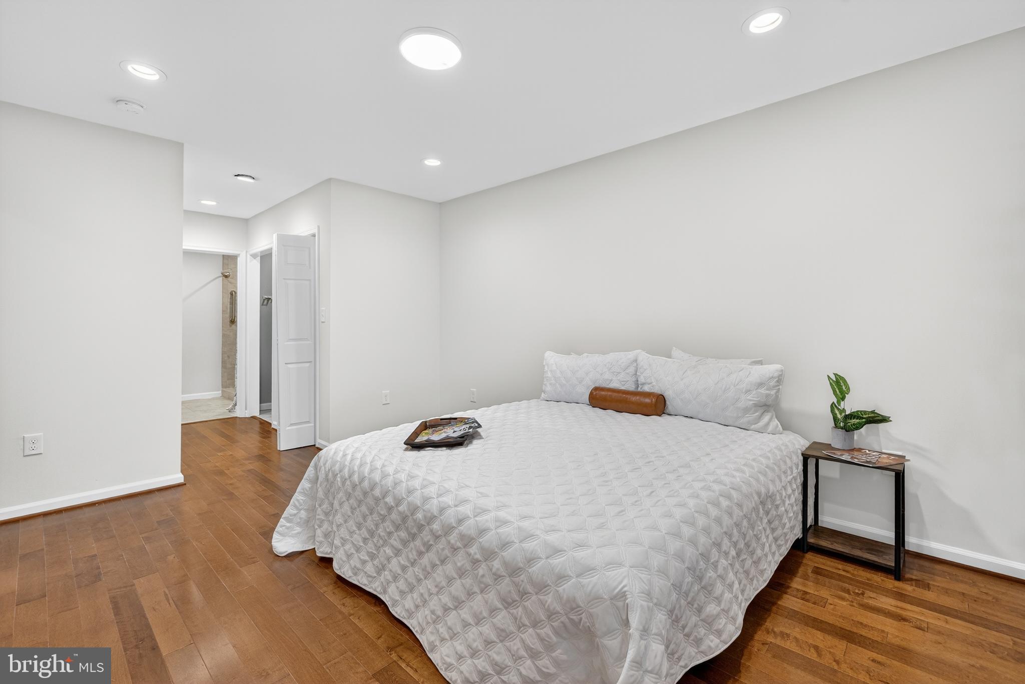 1424 Littlepage Street Fredericksburg, VA 22401 - Photo 20 of 34 a bedroom with a bed and wooden floor