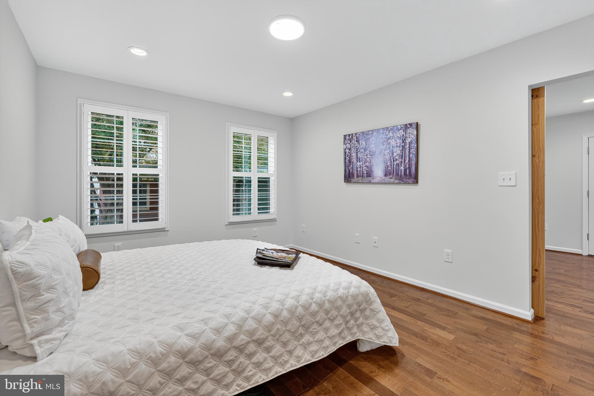 1424 Littlepage Street Fredericksburg, VA 22401 - Photo 21 of 34 a bedroom with a bed and wooden floor