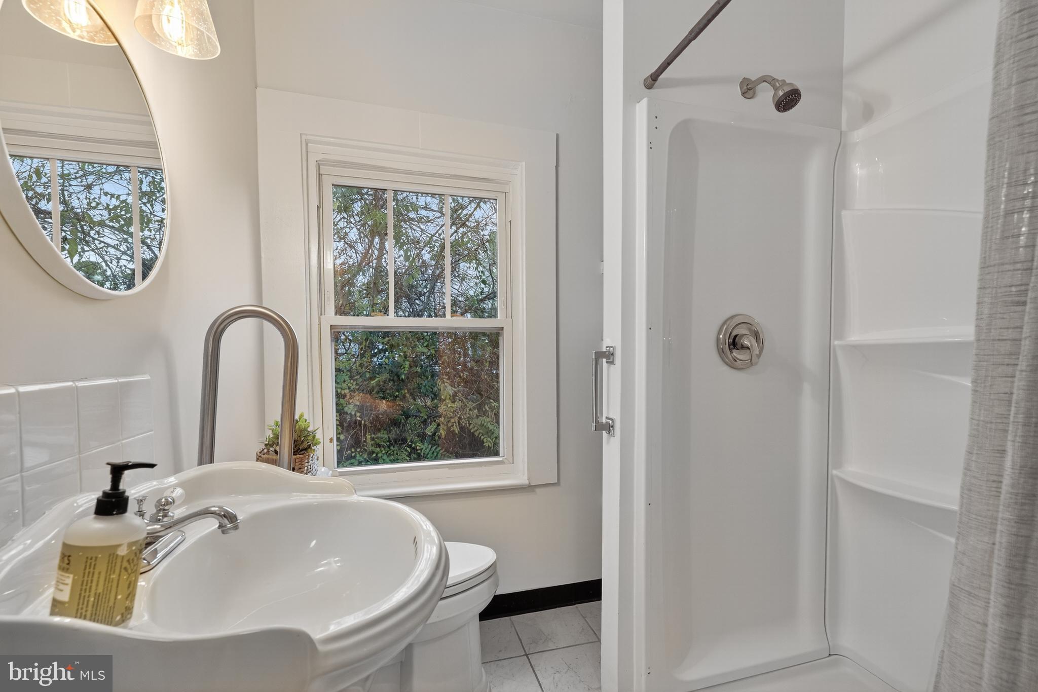 1424 Littlepage Street Fredericksburg, VA 22401 - Photo 10 of 34 a bathroom with a sink and a window