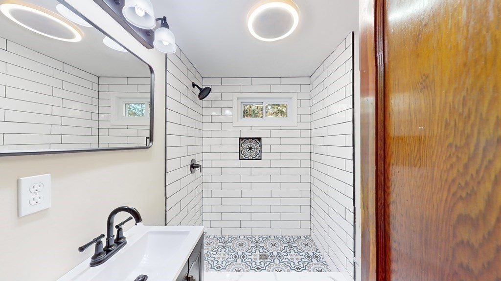 123 Pond Street Georgetown, MA 01833 - Photo 11 of 23 a bathroom with a sink and a mirror