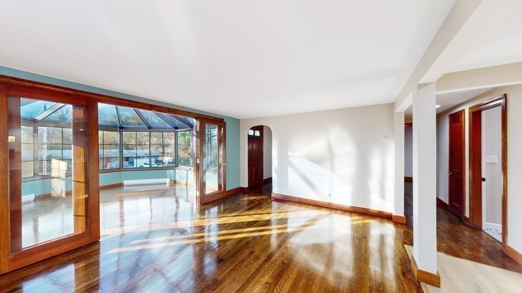 123 Pond Street Georgetown, MA 01833 - Photo 16 of 23 a view of empty room with wooden floor and fan
