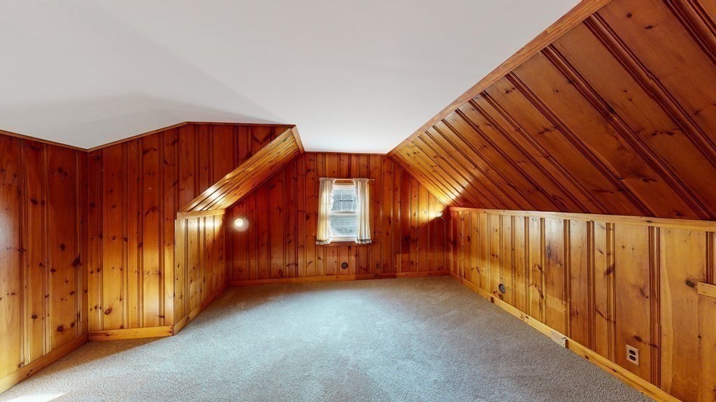 123 Pond Street Georgetown, MA 01833 - Photo 18 of 23 a view of a room with wooden walls and stairs