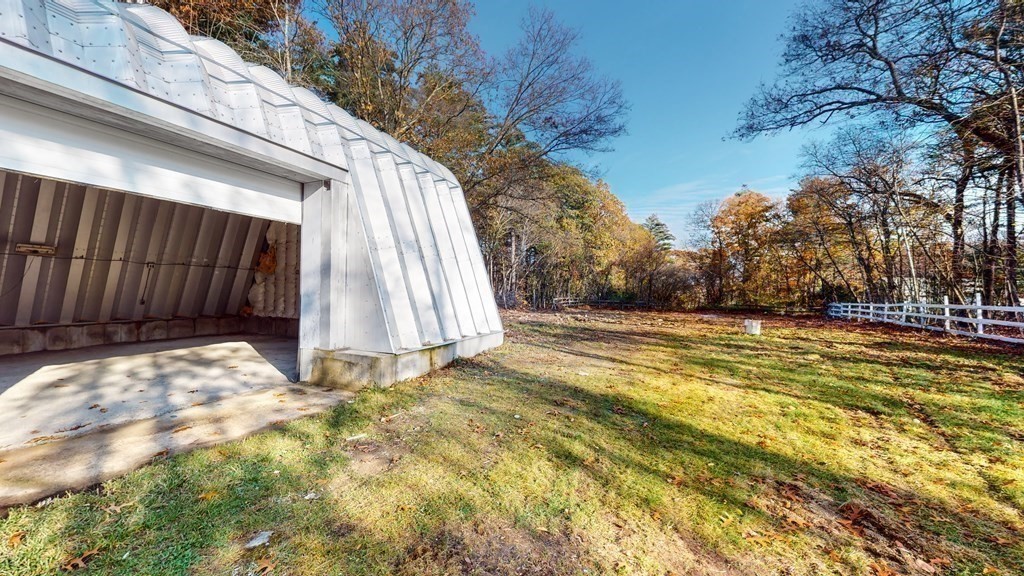123 Pond Street Georgetown, MA 01833 - Photo 21 of 23 a view of backyard with wooden fence and large trees