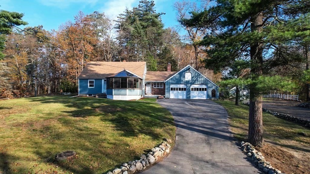 123 Pond Street Georgetown, MA 01833 - Photo 23 of 23 a front view of a house with garden