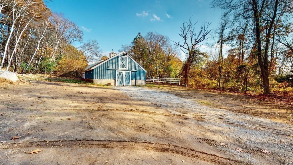 123 Pond Street Georgetown, MA 01833 - Photo 6 of 23 a view of a house with snow on the road