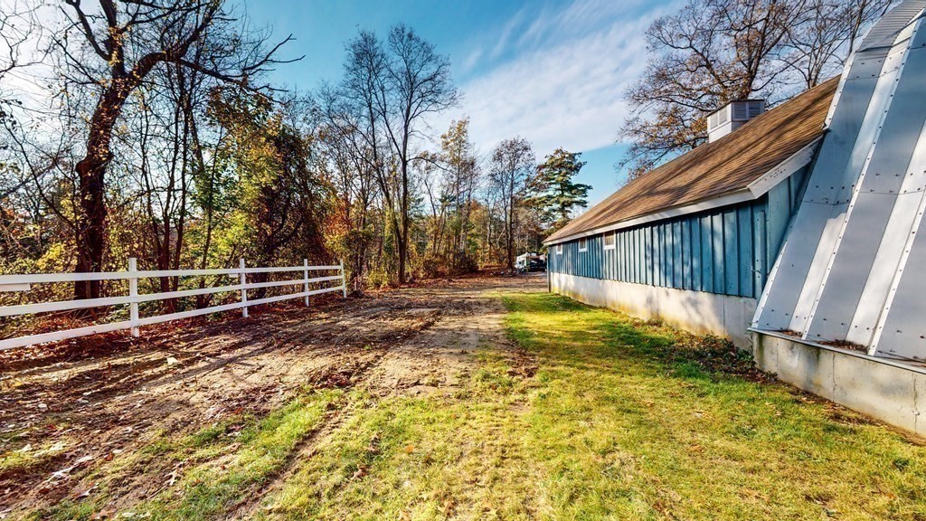 123 Pond Street Georgetown, MA 01833 - Photo 7 of 23 a view of small yard with wooden fence