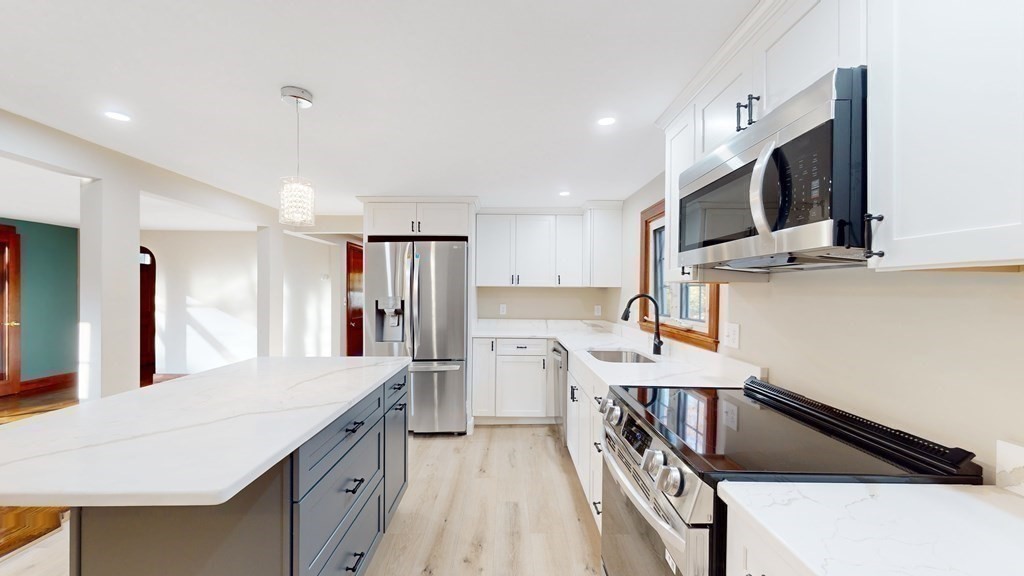 123 Pond Street Georgetown, MA 01833 - Photo 8 of 23 a kitchen with refrigerator and cabinets