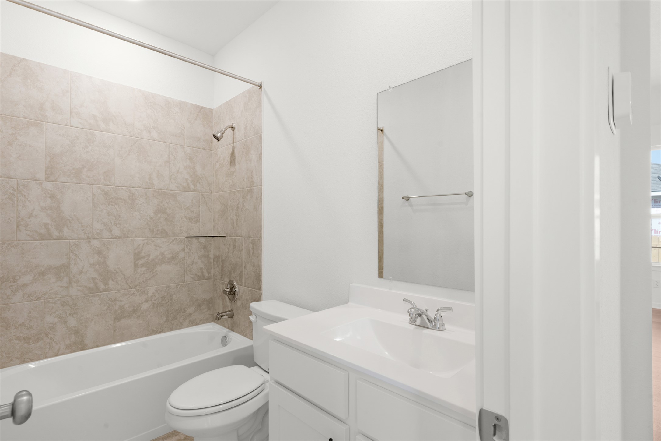25601 Flora Bella Lane Elgin, TX 78621 - Photo 20 of 27 a bathroom with a toilet a sink and a bathtub