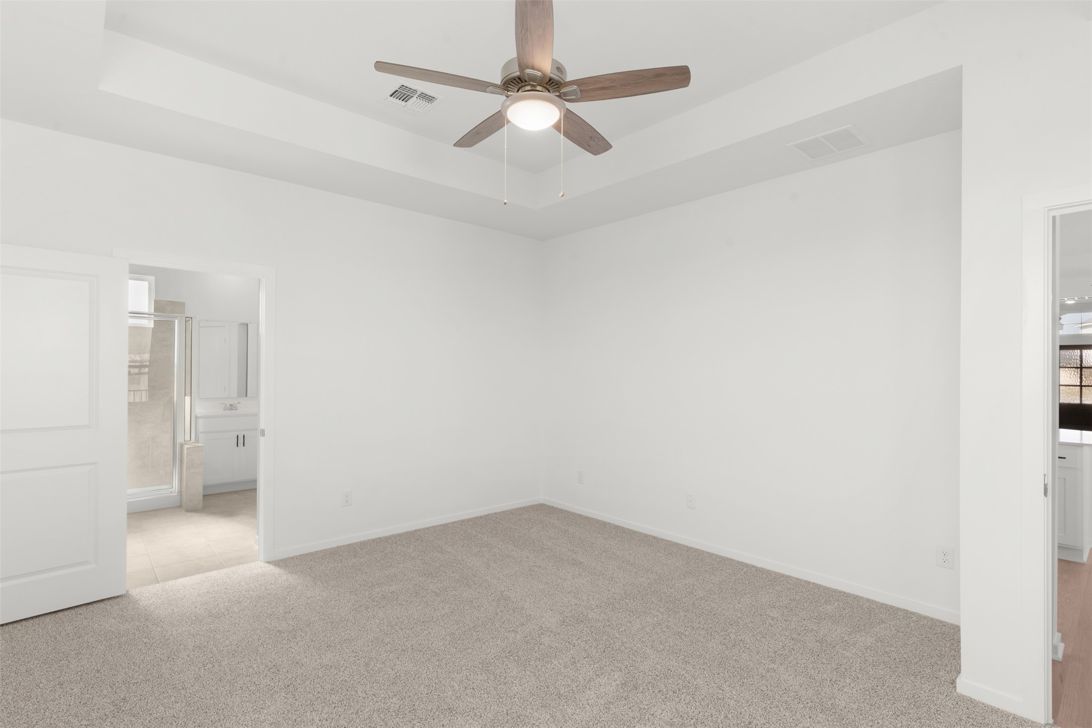 25601 Flora Bella Lane Elgin, TX 78621 - Photo 23 of 27 an empty room with a ceiling fan and bathroom