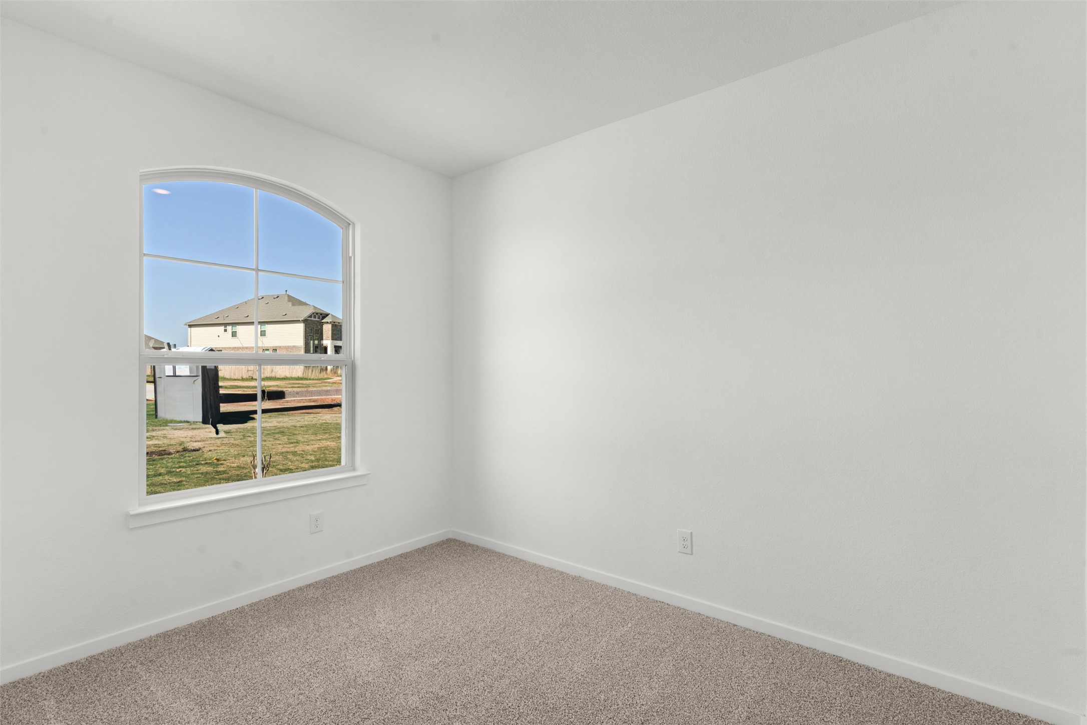 25601 Flora Bella Lane Elgin, TX 78621 - Photo 9 of 27 an empty room with windows