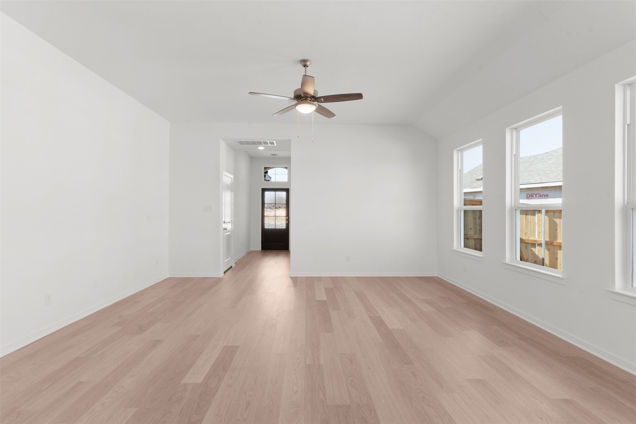 25601 Flora Bella Lane Elgin, TX 78621 - Photo 12 of 27 wooden floor in an empty room with a window