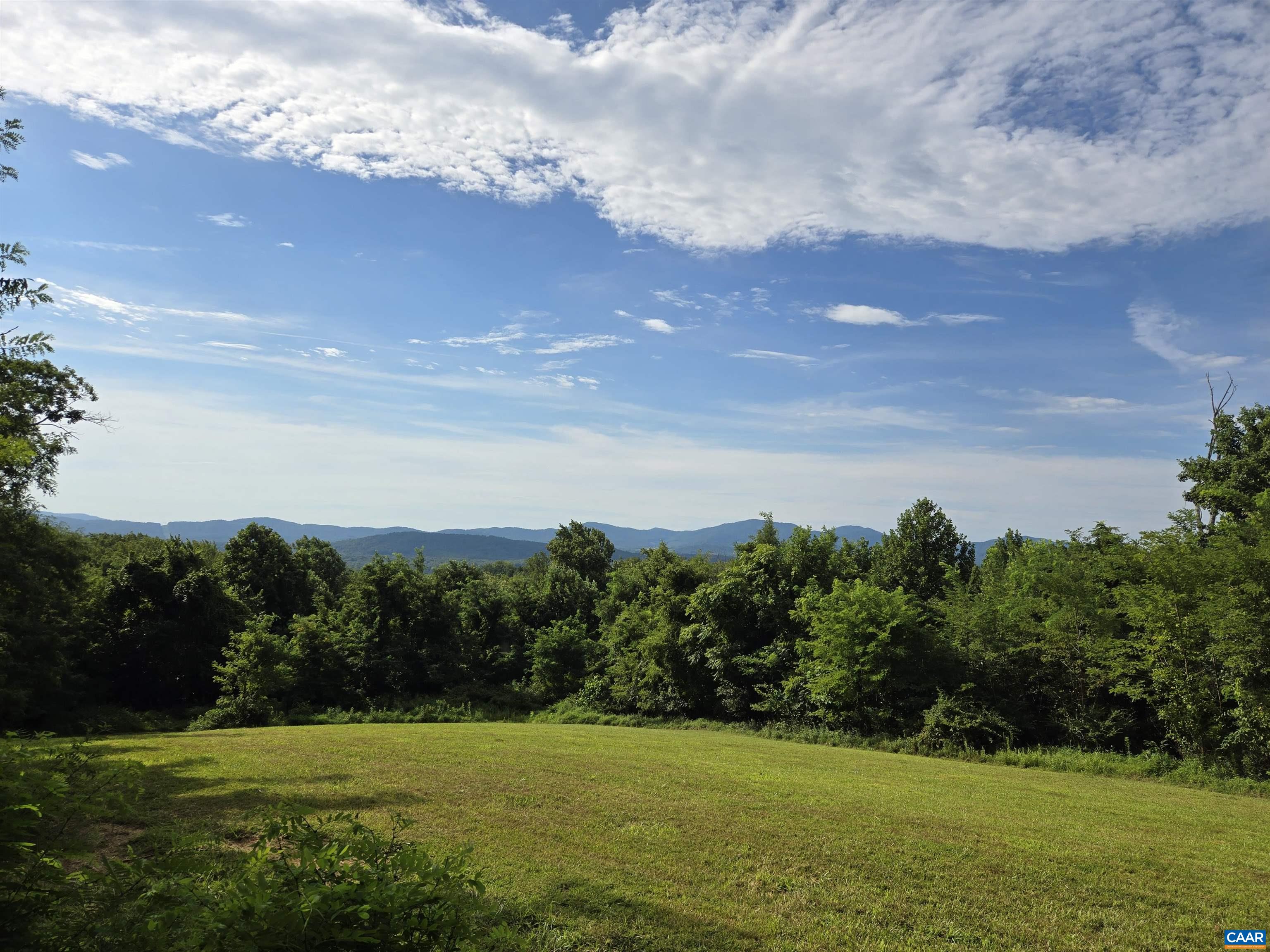 6 Orchard Ridge Road Greenwood, VA 22943 - Photo 4 of 4 a view of a lake with a big yard