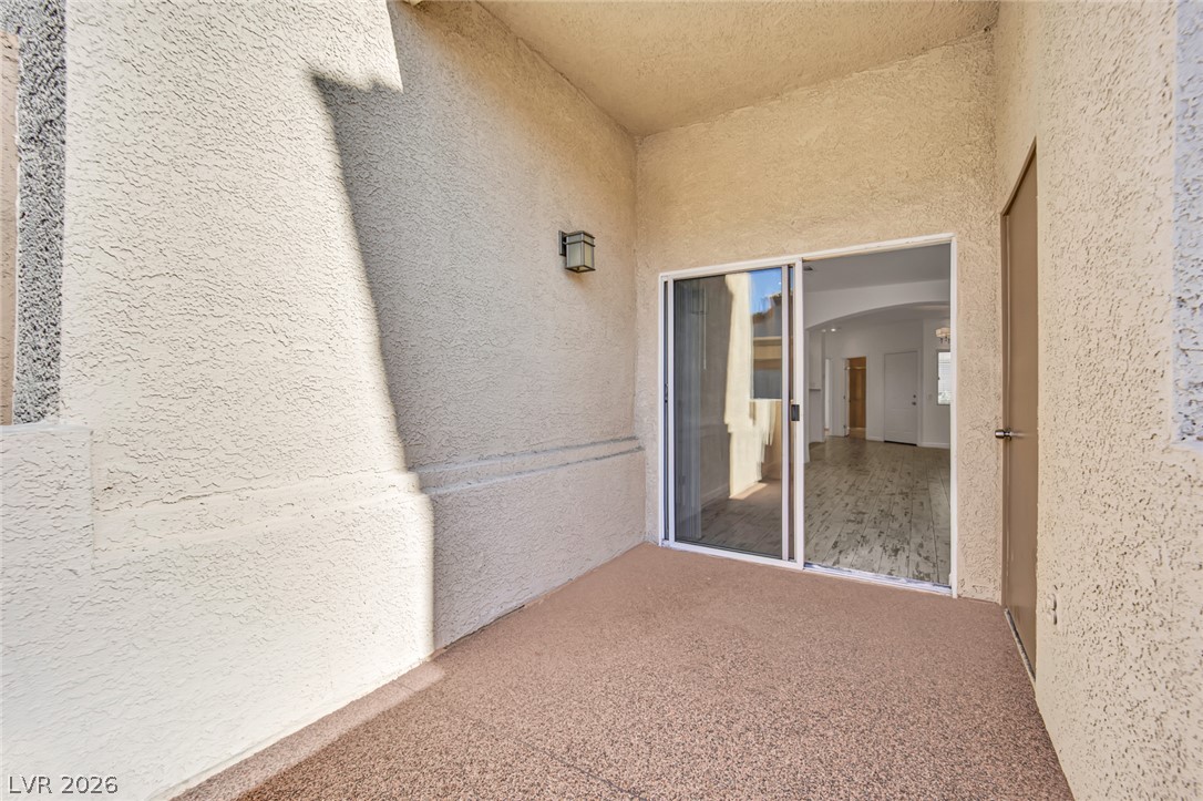8725 West Flamingo Road, Unit 110 Las Vegas, NV 89147 - Photo 4 of 30 An inviting private patio awaits, perfect for peaceful mornings or relaxing evenings.