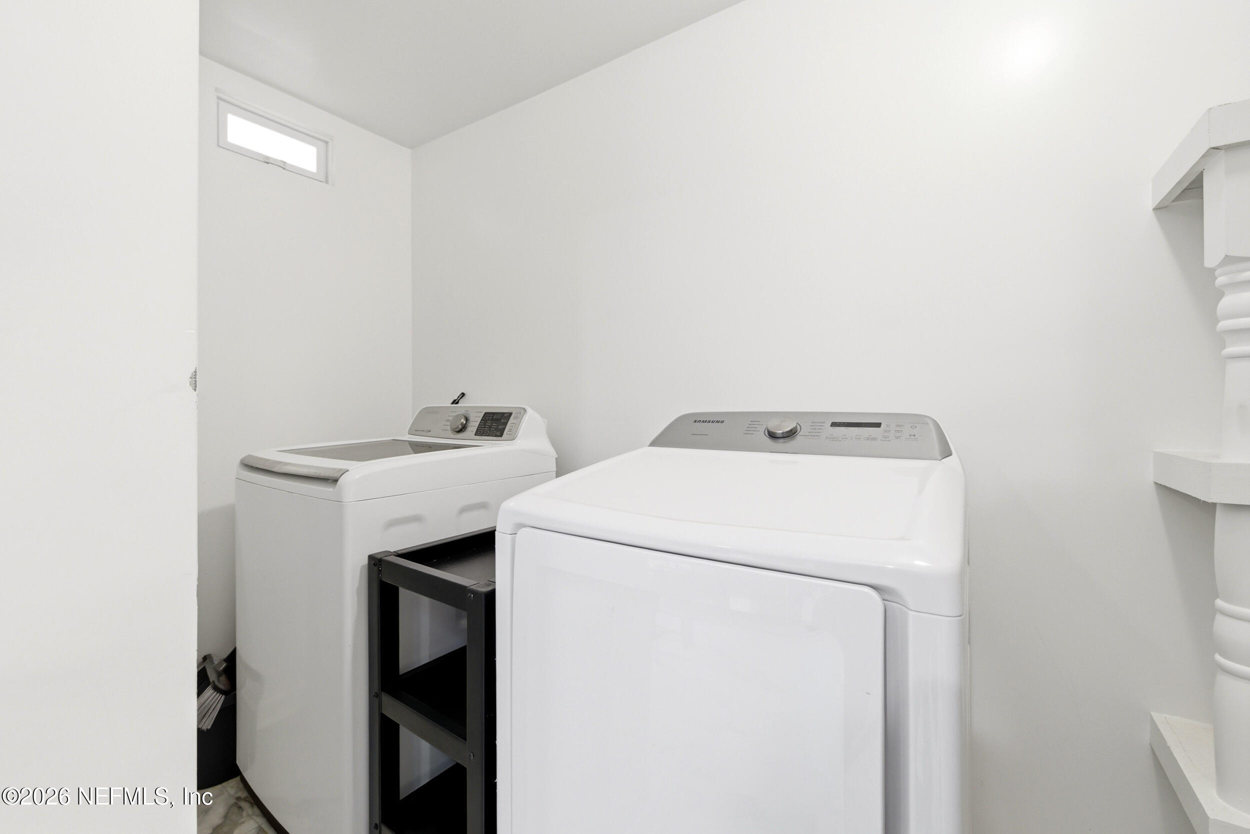 7484 Spinola Road Jacksonville, FL 32217 - Photo 25 of 63 a utility room with dryer and washer