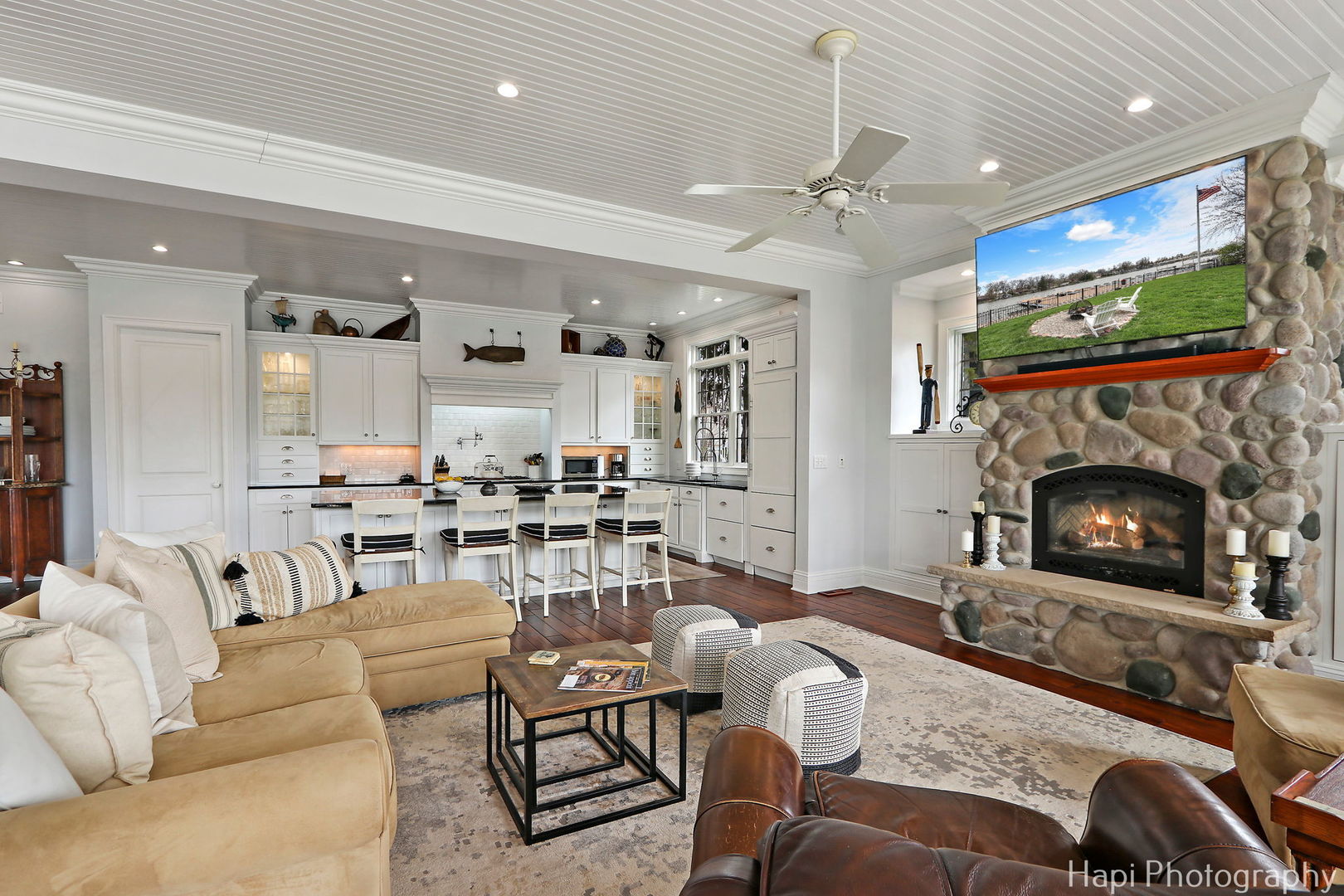1828 Orchard Beach Road McHenry, IL 60050 - Photo 18 of 80 a living room with furniture a flat screen tv and a fireplace
