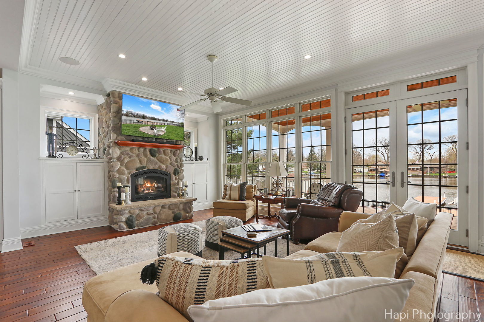 1828 Orchard Beach Road McHenry, IL 60050 - Photo 19 of 80 a living room with furniture and a fireplace