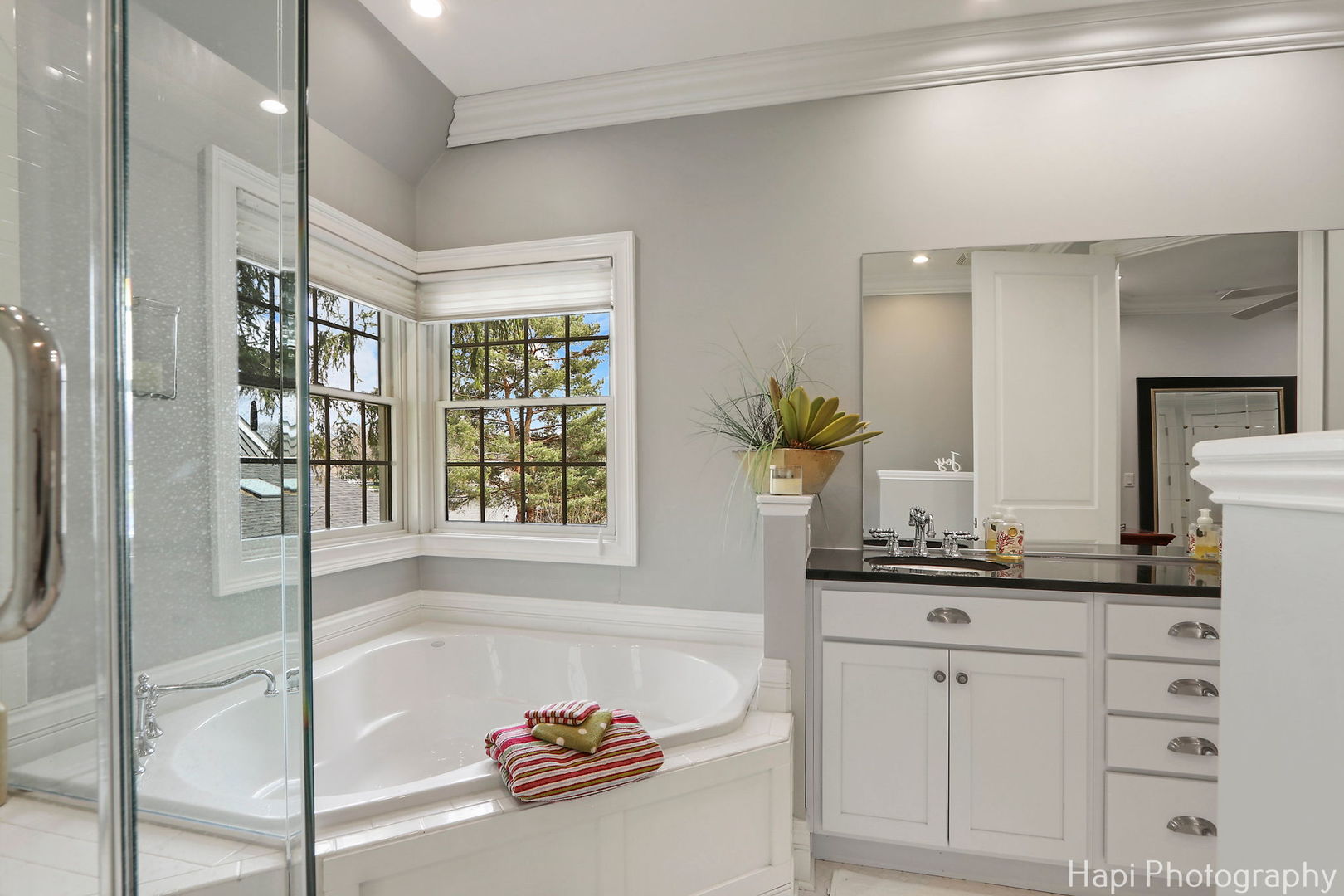 1828 Orchard Beach Road McHenry, IL 60050 - Photo 57 of 80 a bathroom with a tub sink and mirror