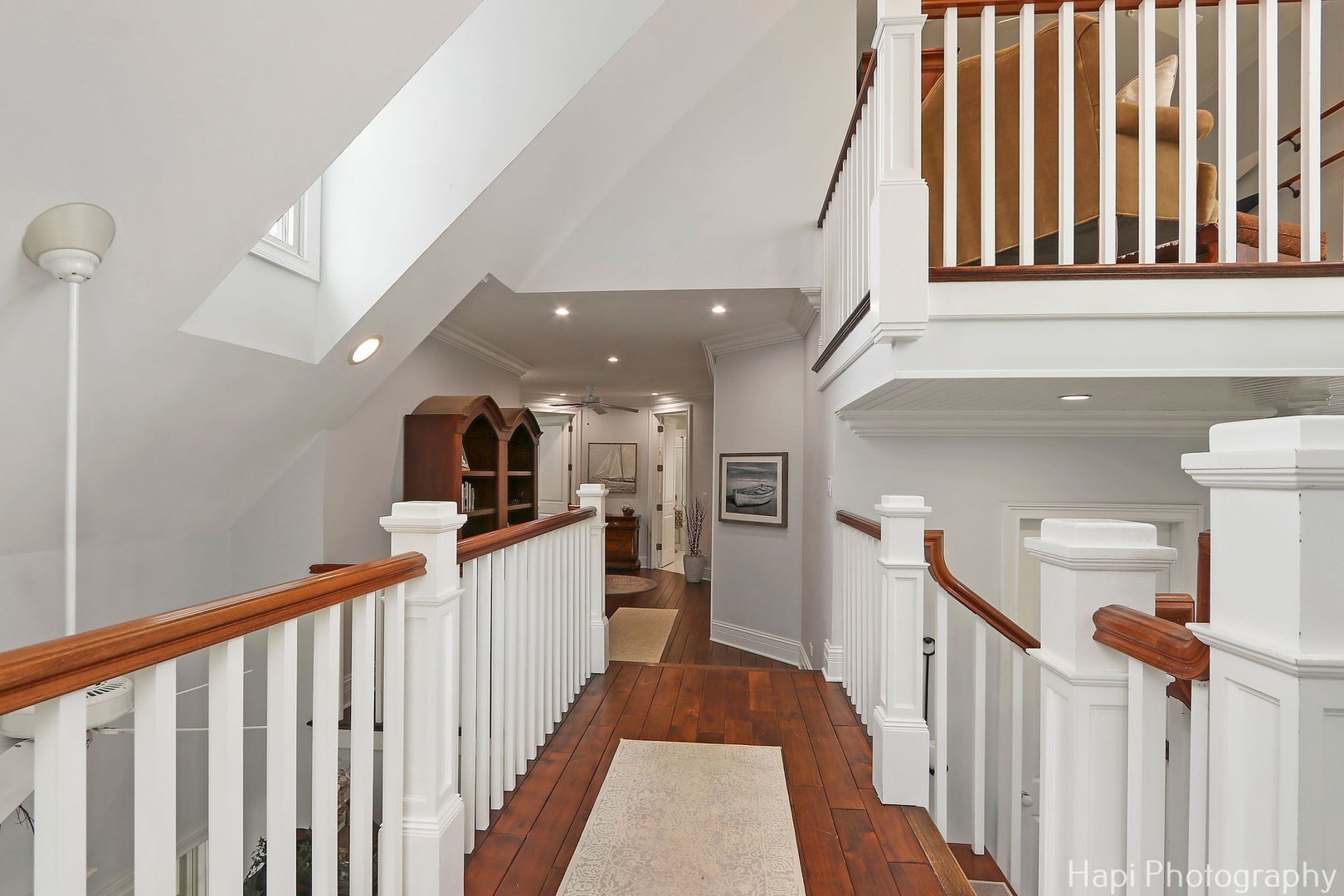 1828 Orchard Beach Road McHenry, IL 60050 - Photo 59 of 80 a hallway with a large cabinets stairs and a large window