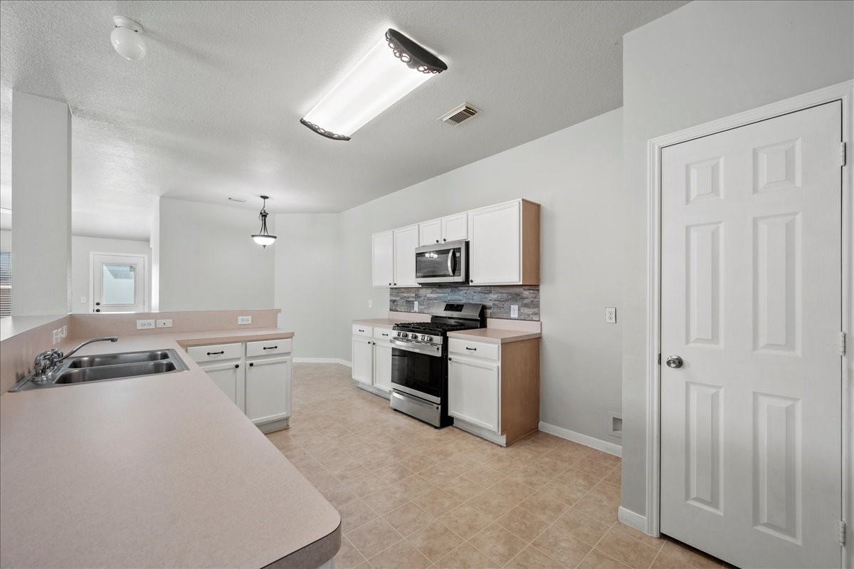 17535 Prospect Meadows Drive Houston, TX 77095 - Photo 12 of 39 The kitchen is designed for both style and functionality, featuring stainless steel appliances that bring a modern touch.