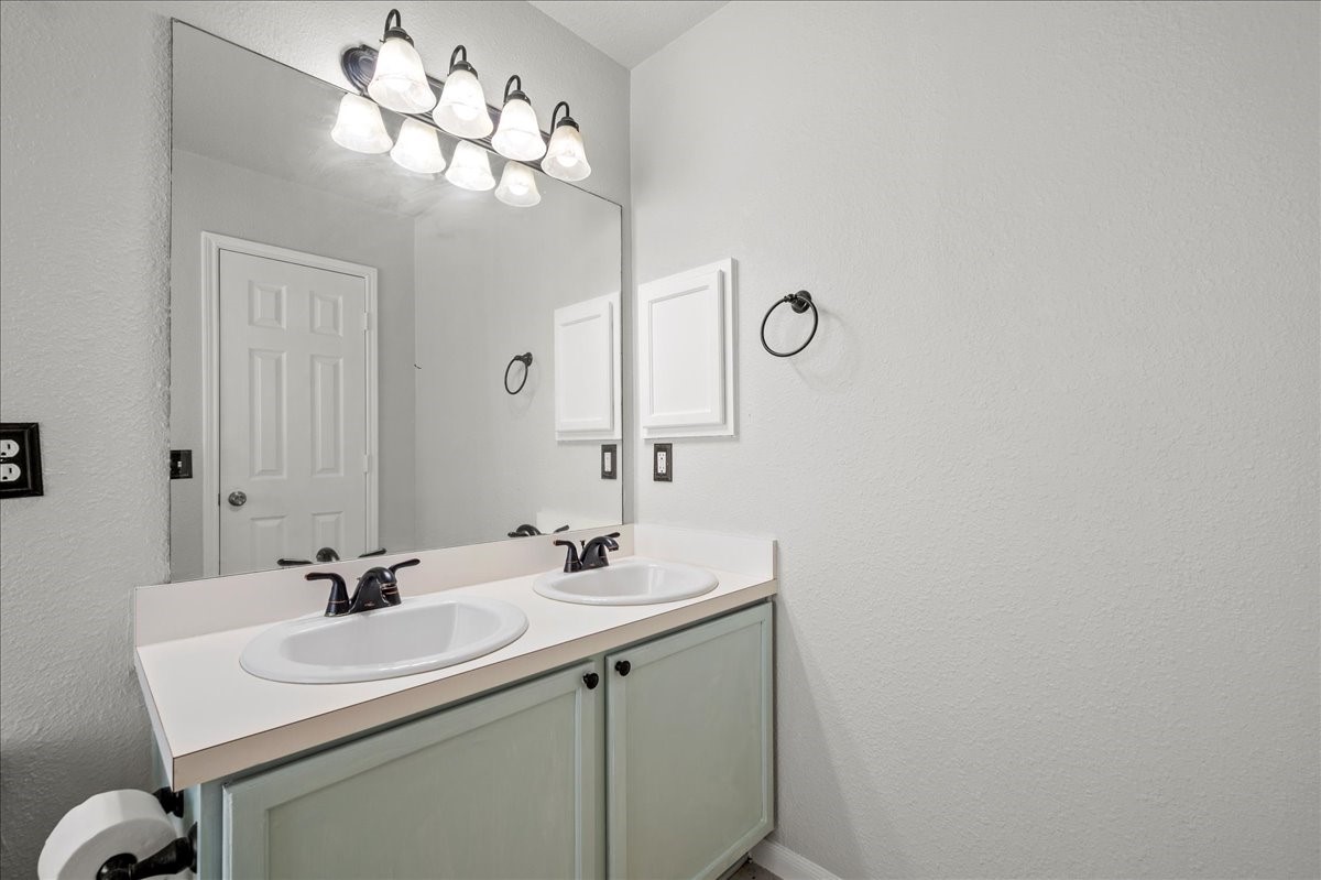 17535 Prospect Meadows Drive Houston, TX 77095 - Photo 20 of 39 The en-suite bath is a luxurious oasis, boasting a spa-like atmosphere with its modern fixtures and double sinks.