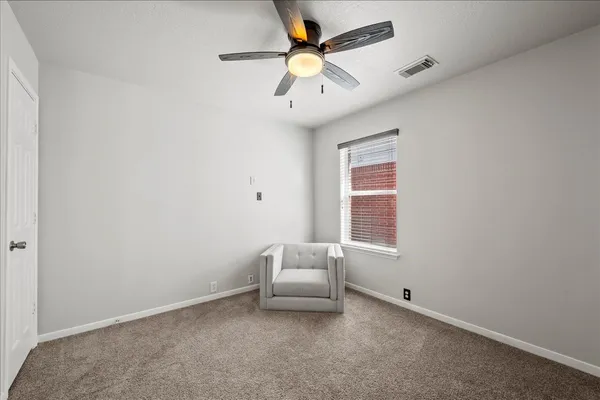 a white bath tub sitting next to a shower