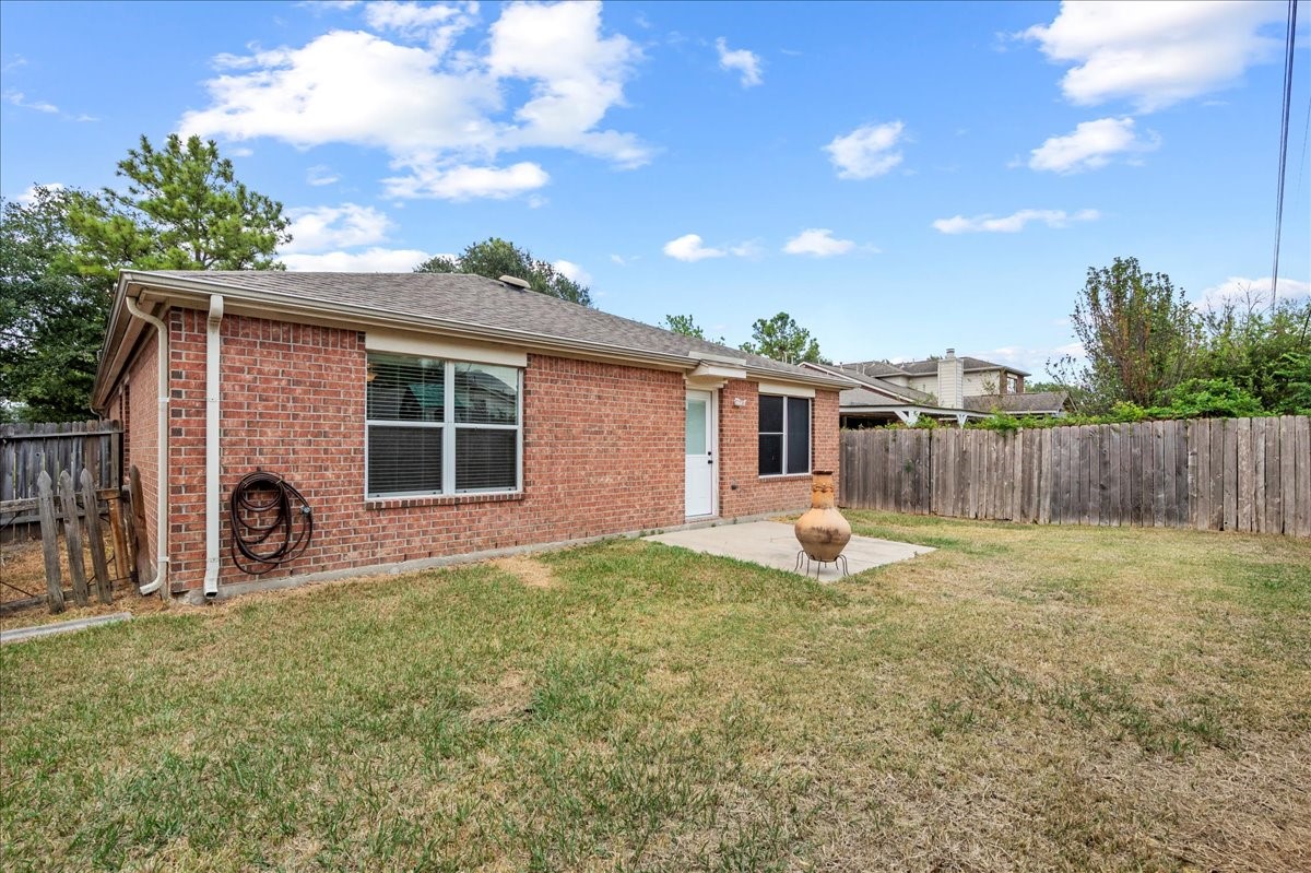 17535 Prospect Meadows Drive Houston, TX 77095 - Photo 29 of 39 Step outside to a fully fenced, generously sized backyard that offers privacy and plenty of space for outdoor activities.