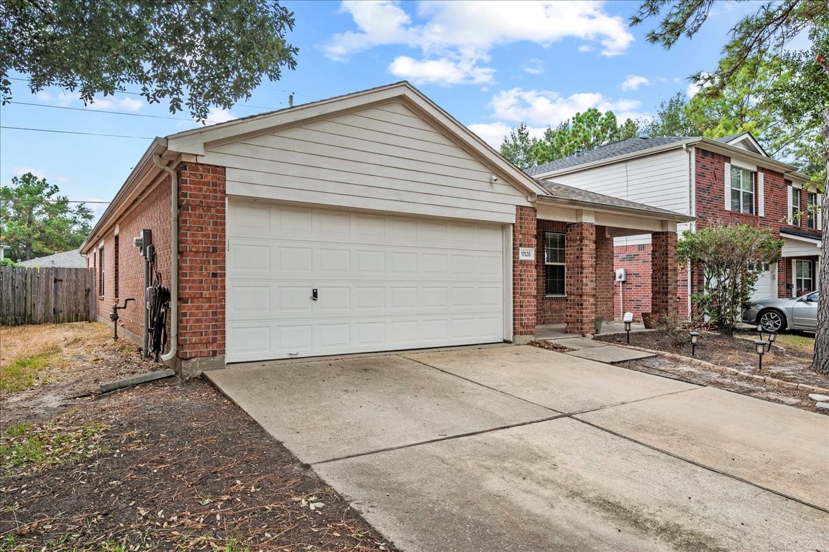 17535 Prospect Meadows Drive Houston, TX 77095 - Photo 3 of 39 Charming brick exterior complemented by a spacious 2-car attached garage and an extended driveway, providing ample parking space for guests and family alike. The well-maintained facade, accented by mature trees and simple landscaping, creates a welcoming first impression.