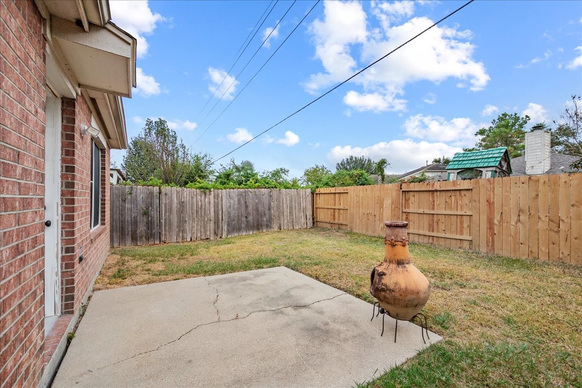 17535 Prospect Meadows Drive Houston, TX 77095 - Photo 31 of 39 The patio area provides an ideal spot for grilling, dining, or relaxing, making it a perfect extension of your living space.