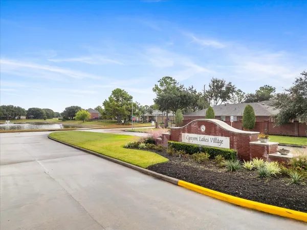 a view of swimming pool with a yard and a fountain
