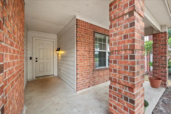 a view of wooden door and entryway