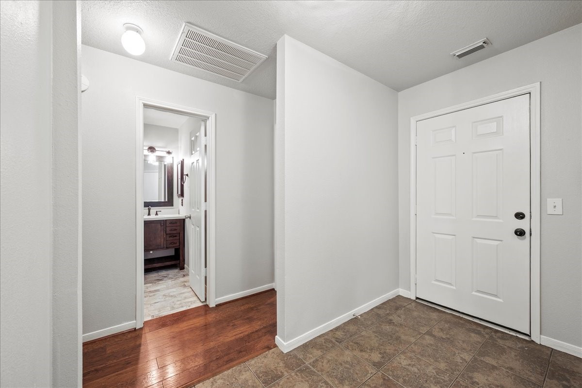 17535 Prospect Meadows Drive Houston, TX 77095 - Photo 6 of 39 The entryway leads into a cozy and functional living space, making this home a perfect blend of style and convenience.