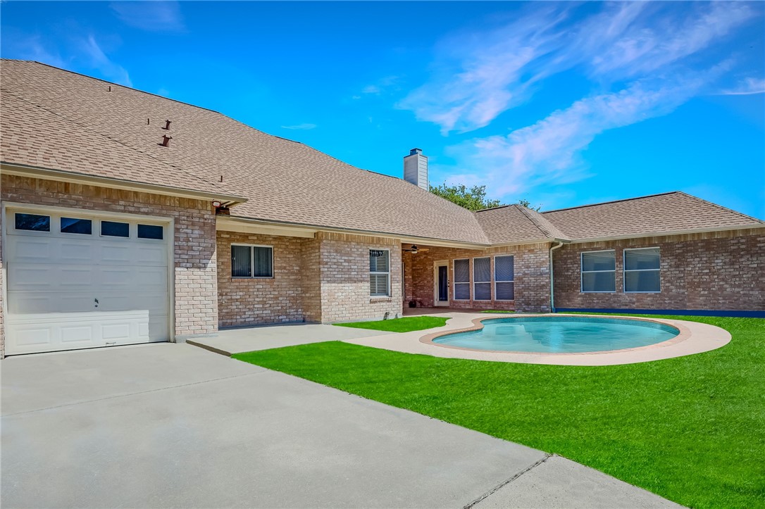 5917 Harvest Hill Road Corpus Christi, TX 78414 - Photo 36 of 40 a front view of a house with a yard