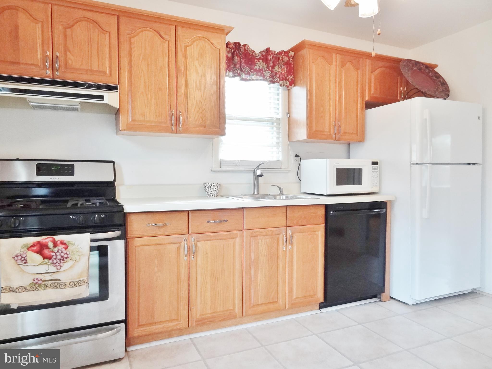 5610 Berwyn Road Berwyn Heights, MD 20740 - Photo 4 of 23 Modern kitchen with microwave, DW & gas stove