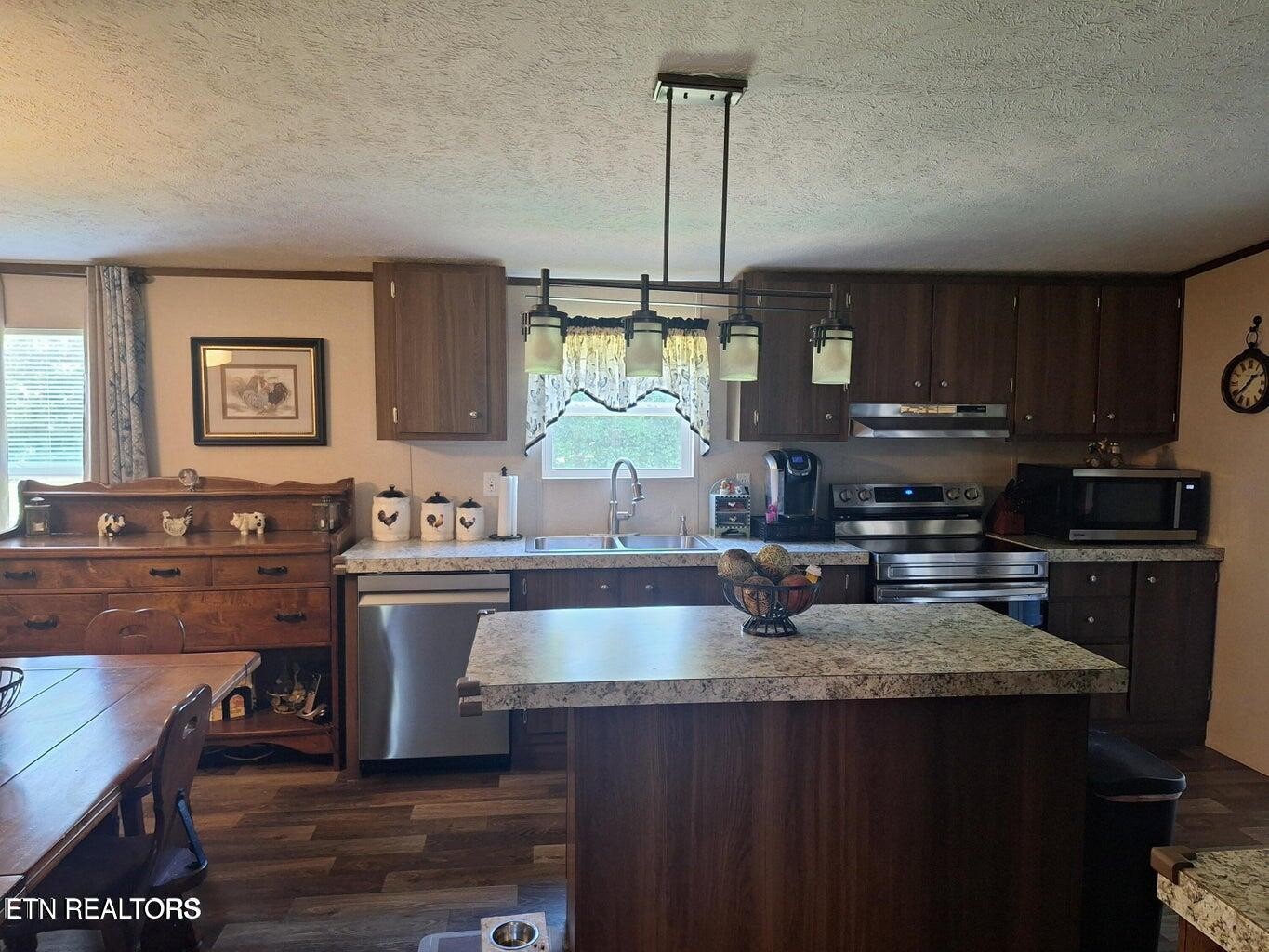 1450 Belltown Road Tellico Plains, TN 37385 - Photo 25 of 32 a kitchen with sink cabinets and window