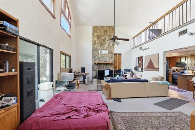 a view of staircase with lots of frames on wall