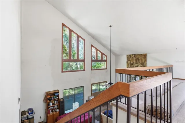 a view of a hallway with paintings on the wall
