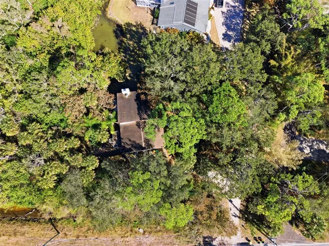 an aerial view of a house with a garden