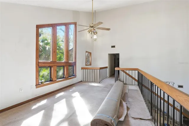 a view of a hallway with windows