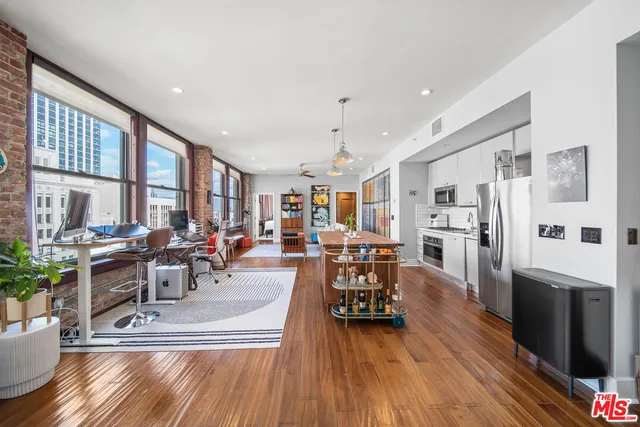 a view of a living room kitchen and dining room